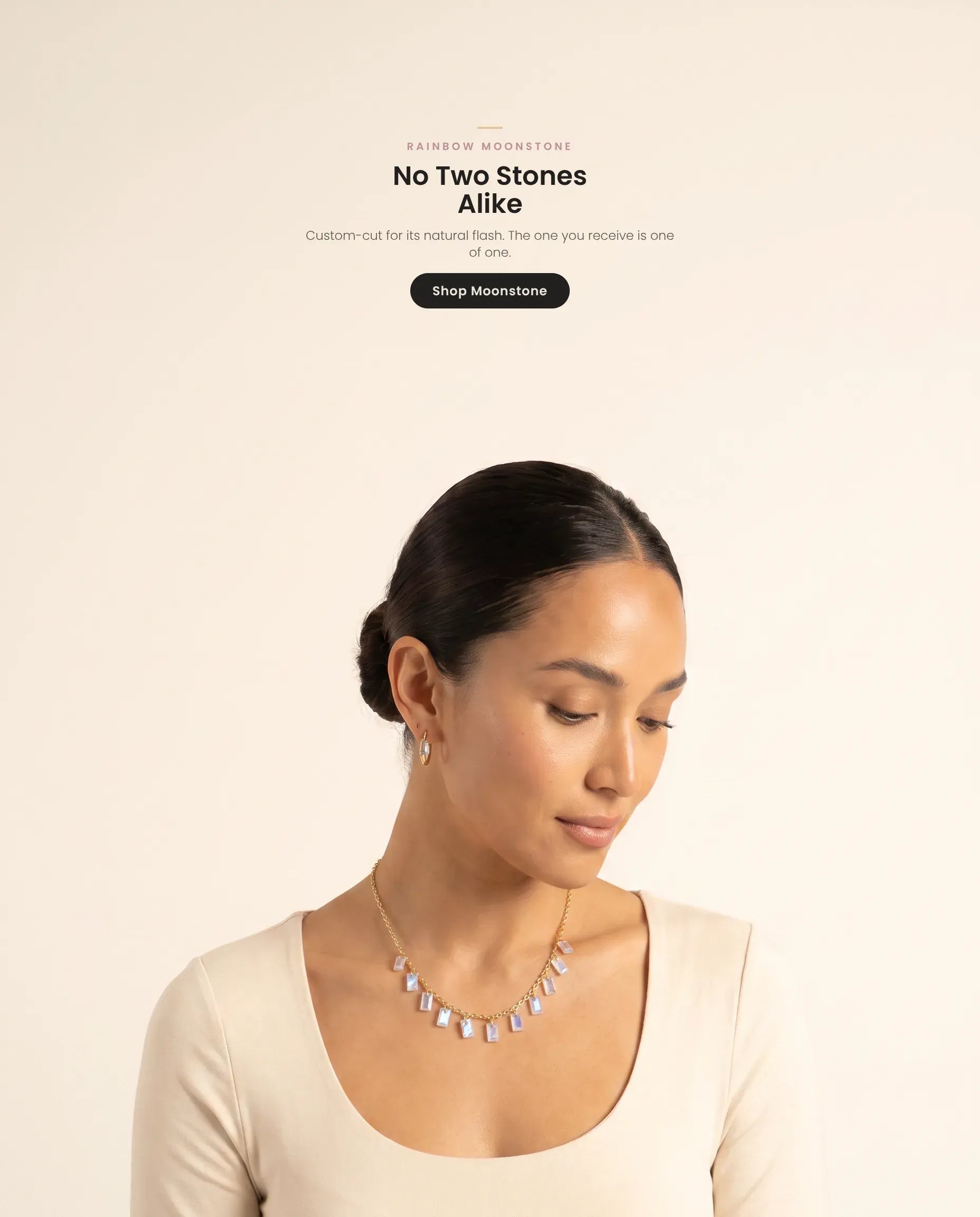 Homepage hero banner (mobile, web-optimized, crop-safe v3) — model wearing the Baguette Charms rainbow moonstone necklace
